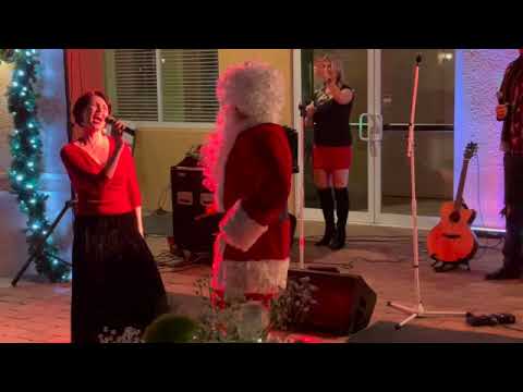 Angela Watson sings, "We Love Santa Claus"