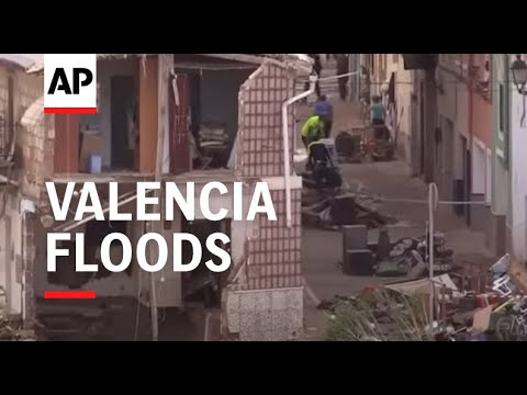 Residents of Valencian town of Chiva assess damage, collect bottled water